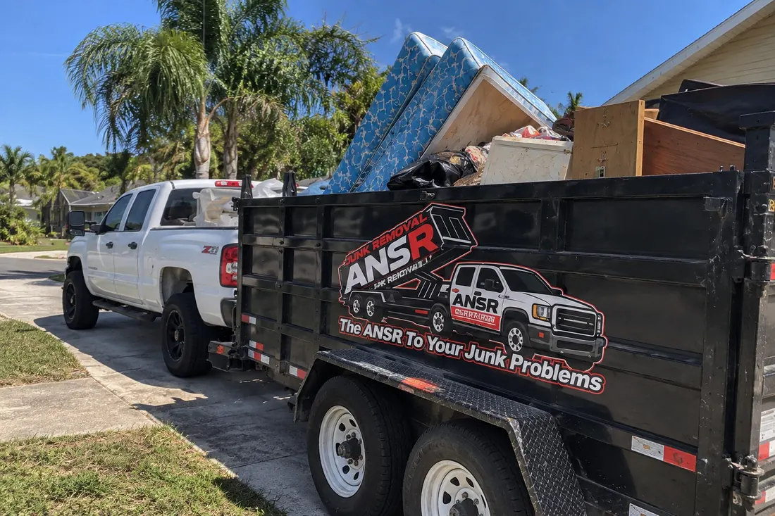 ANSR branded truck and junk removal trailer